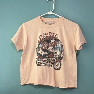 Light pink / tan shirt with motorcycle and “take the scenic route” on the front